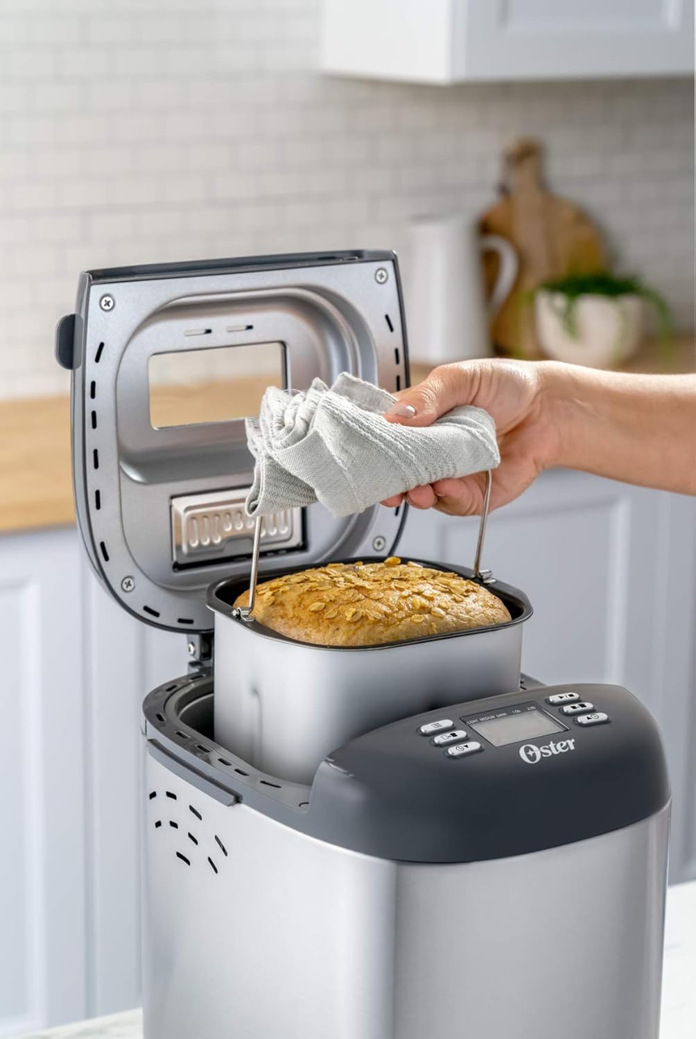 Oster Bread Maker with ExpressBake and 12 Preset Functions Including Gluten Free, 2 Pound Capacity, Stainless Steel & Black