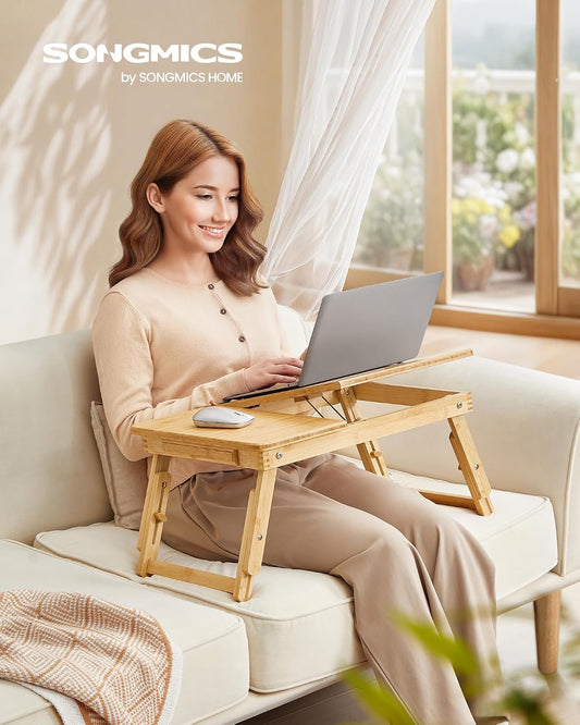 SONGMICS Laptop Desk for Bed or Sofa with Tilting Top, Breakfast Serving Tray with Folding Legs, Fits up to 15.6 Inches Screen, (24-26.9) x 13.7 x (8.8-12.6) Inches, Natural ULLD01N